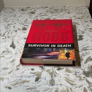 'Survivor in Death' Book - Red Cover